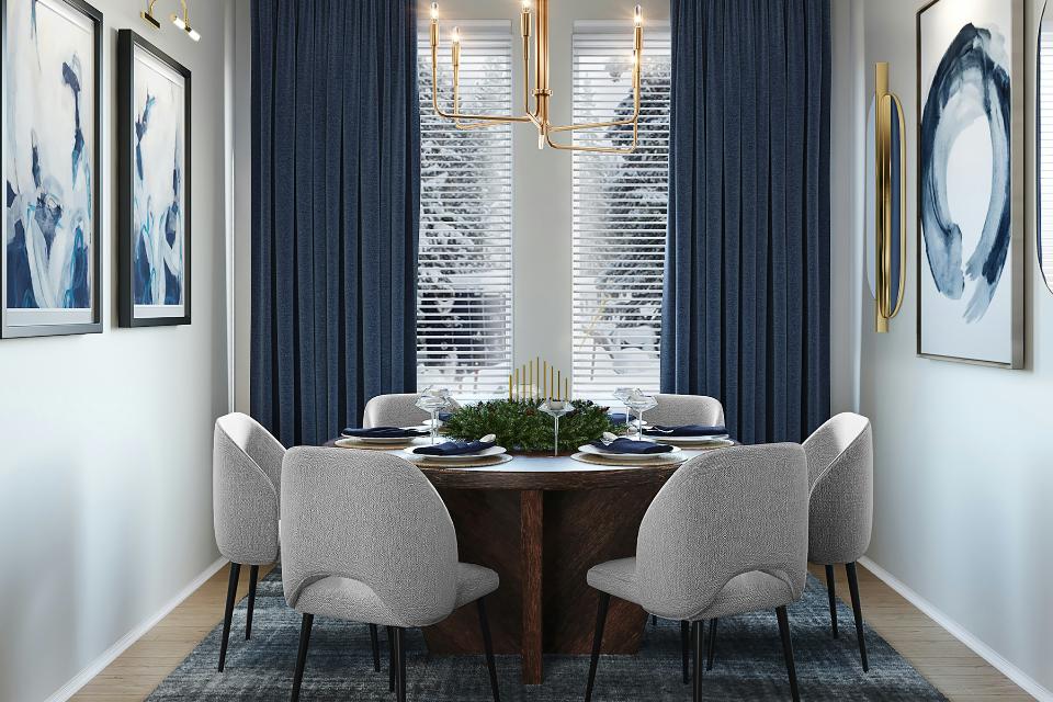 dining room with blue area rug and holiday decor.